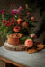 pink and yellow flowers on brown wooden table